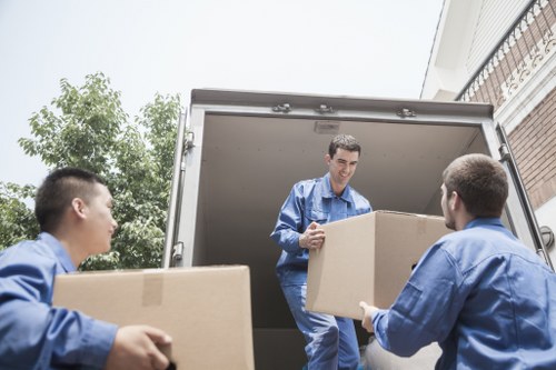 Furniture dismantling and setup during an office move in Ruislip