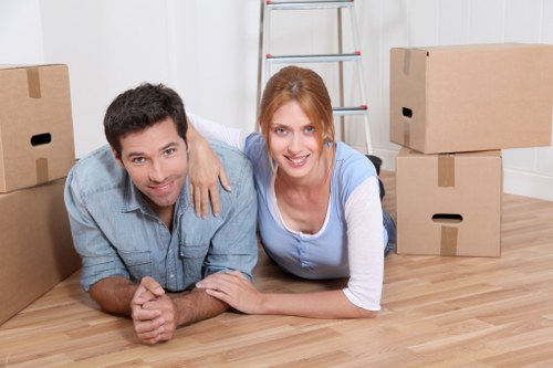 House removalists handling furniture in a Ruislip home