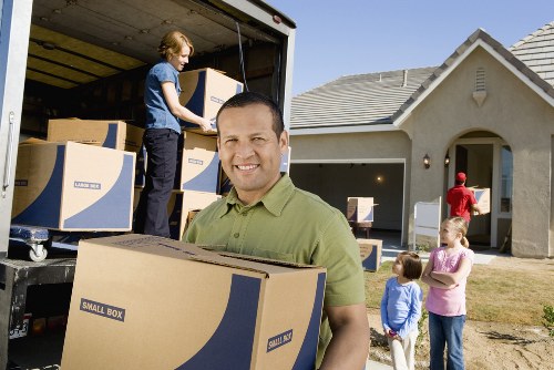 Packing boxes and furniture ready for a moving van in Ruislip