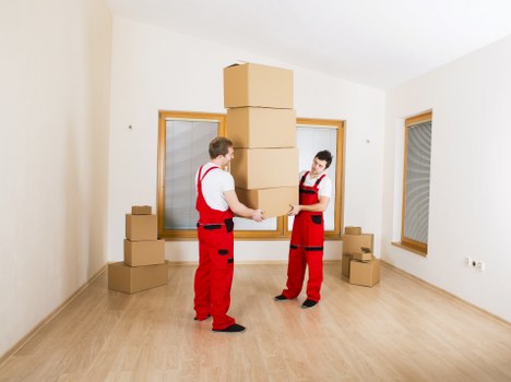 Careful boxing and labeling of household items for relocation